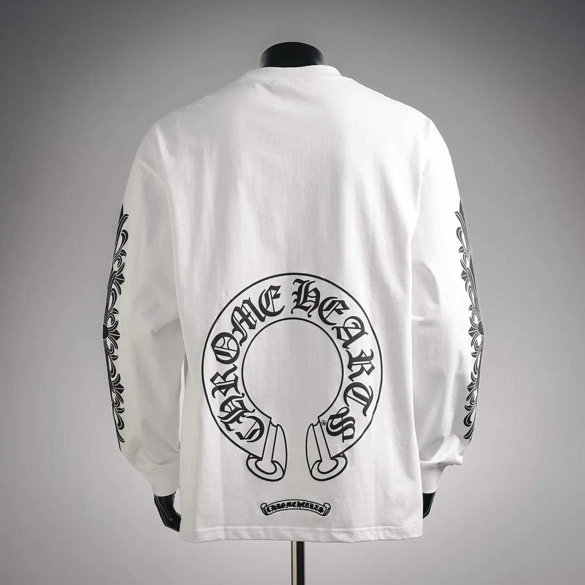 White long-sleeve graphic T-shirt with back headphone-style emblem