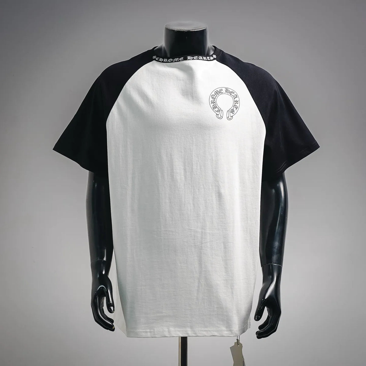 Black-and-white raglan T-shirt with small front Chrome Hearts graphic