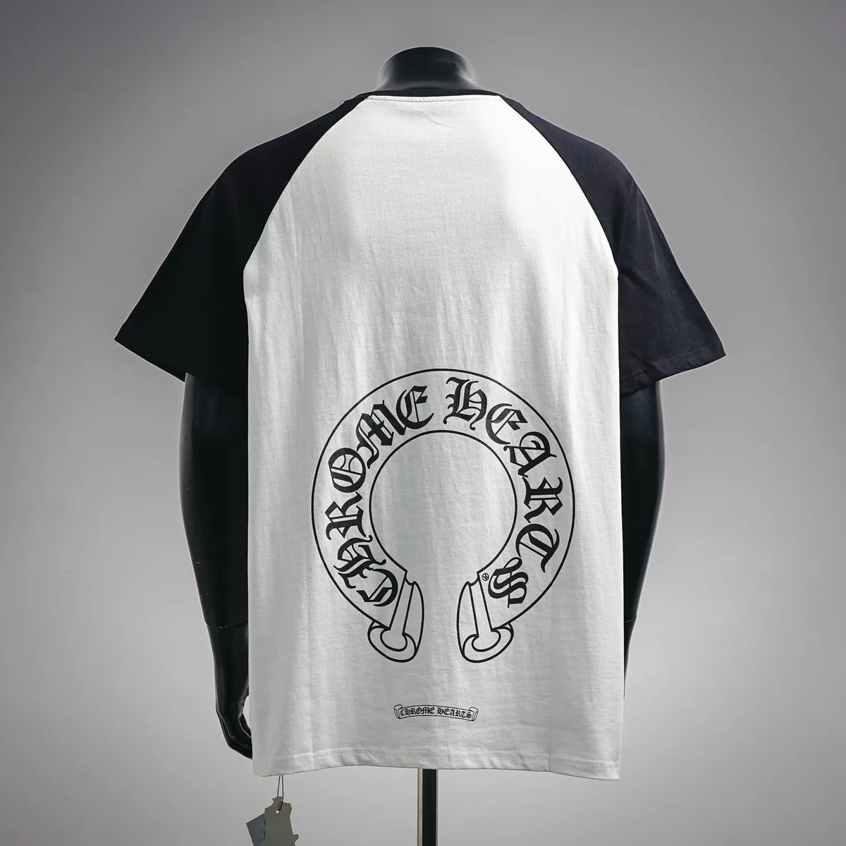 Black-and-white raglan T-shirt back with large circular Chrome Hearts graphic