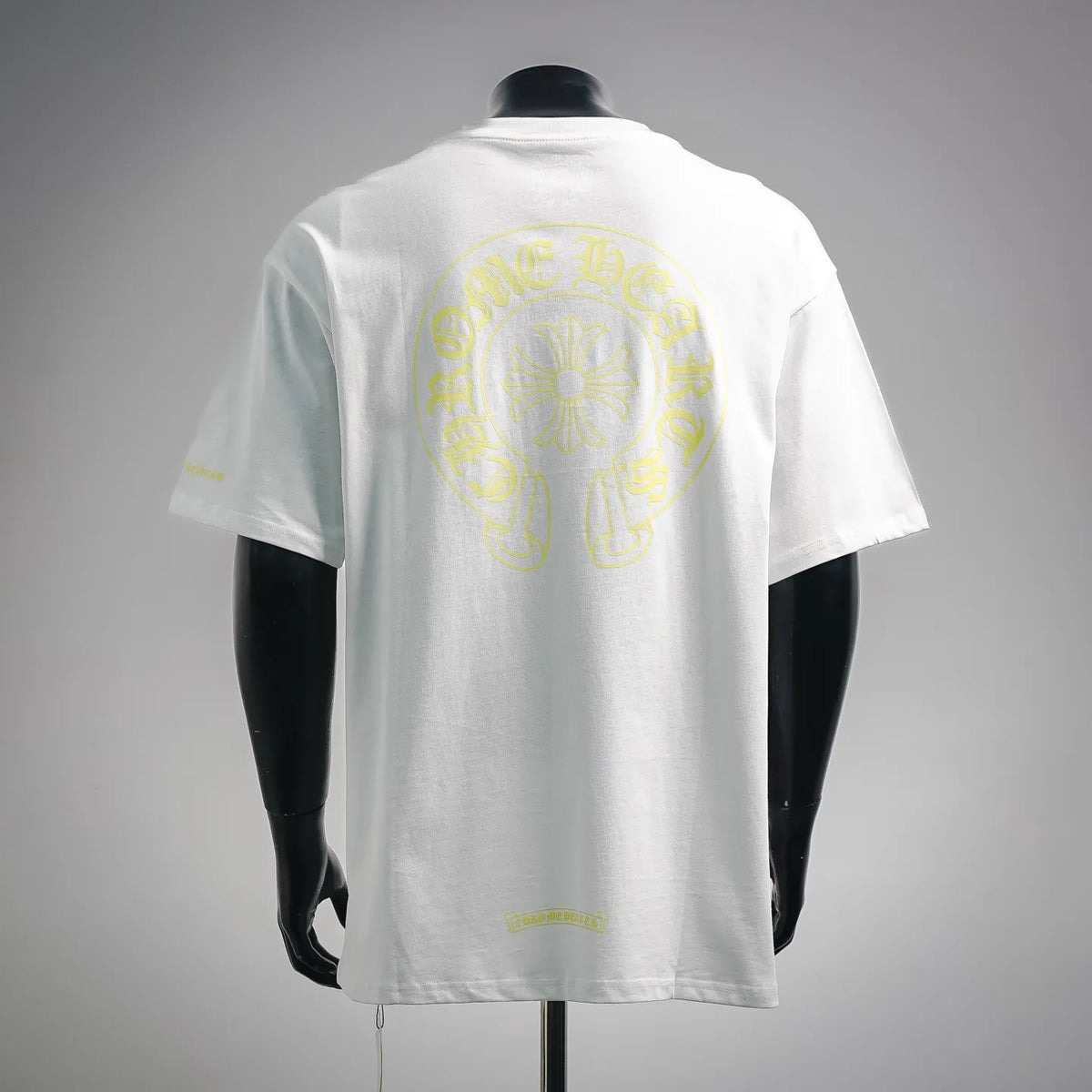White short-sleeve T-shirt showing large yellow back graphic centered