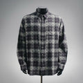 Long-sleeve button-up shirt in dark plaid with floral pattern and button front
