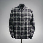 Long-sleeve button-up shirt in dark plaid with floral pattern and button front
