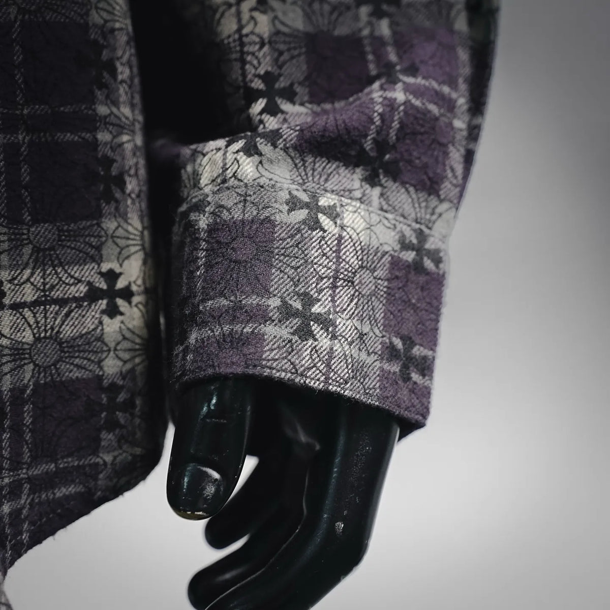 Shirt cuff and hem detail, dark plaid with purple floral pattern