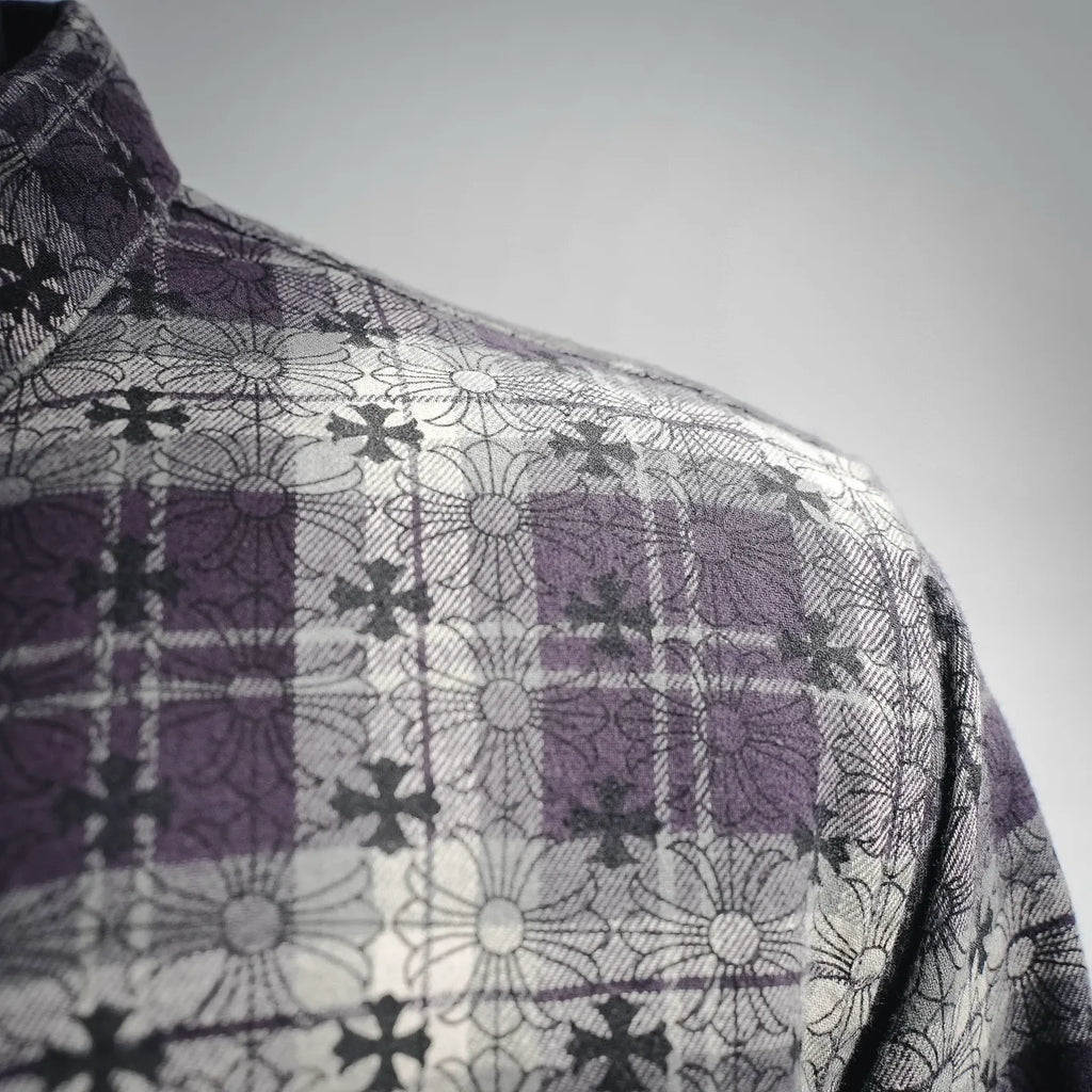 Shoulder and upper sleeve of shirt, dark plaid with purple and floral print