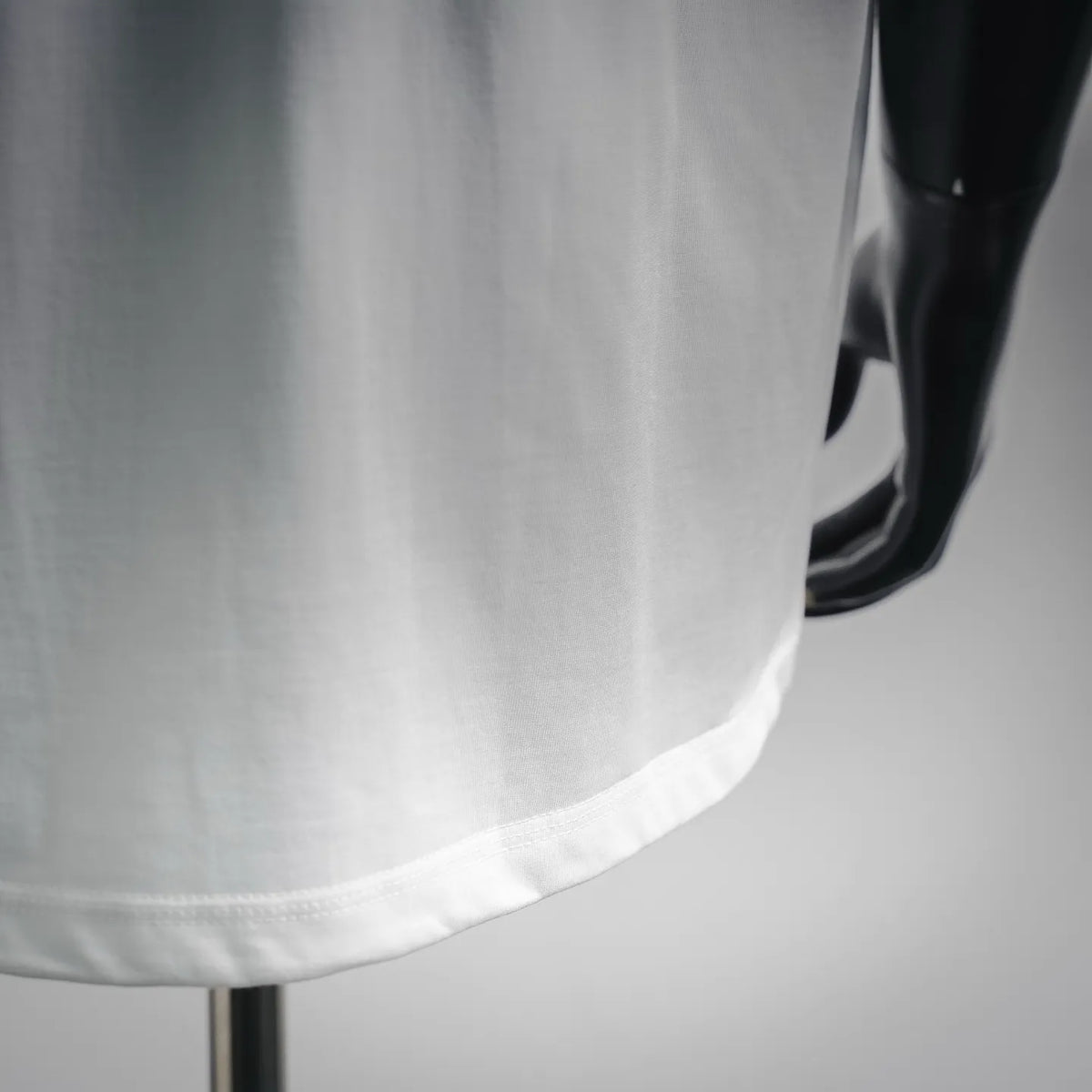 White T-shirt lower hem and side seam detail