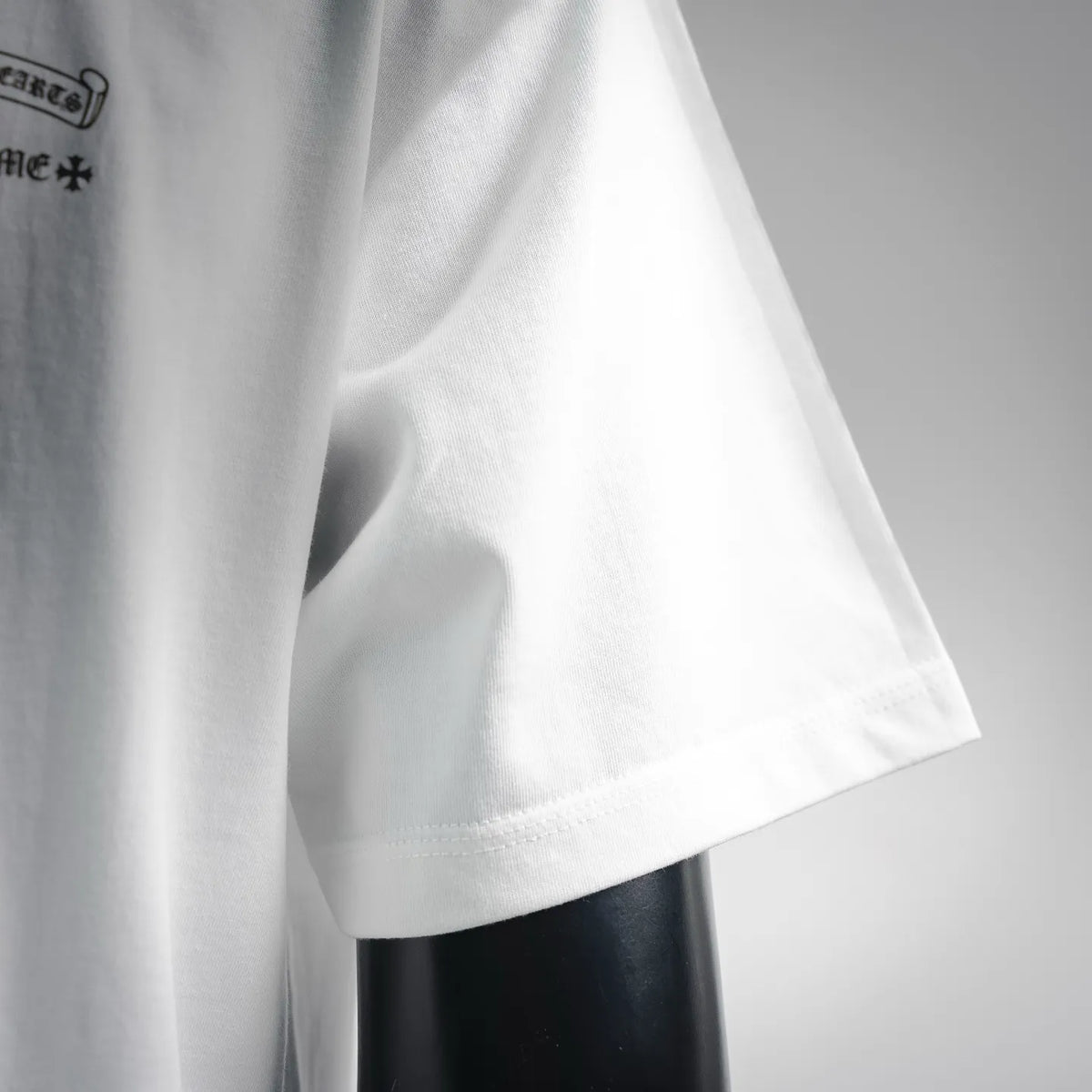 White T-shirt sleeve and side seam close-up
