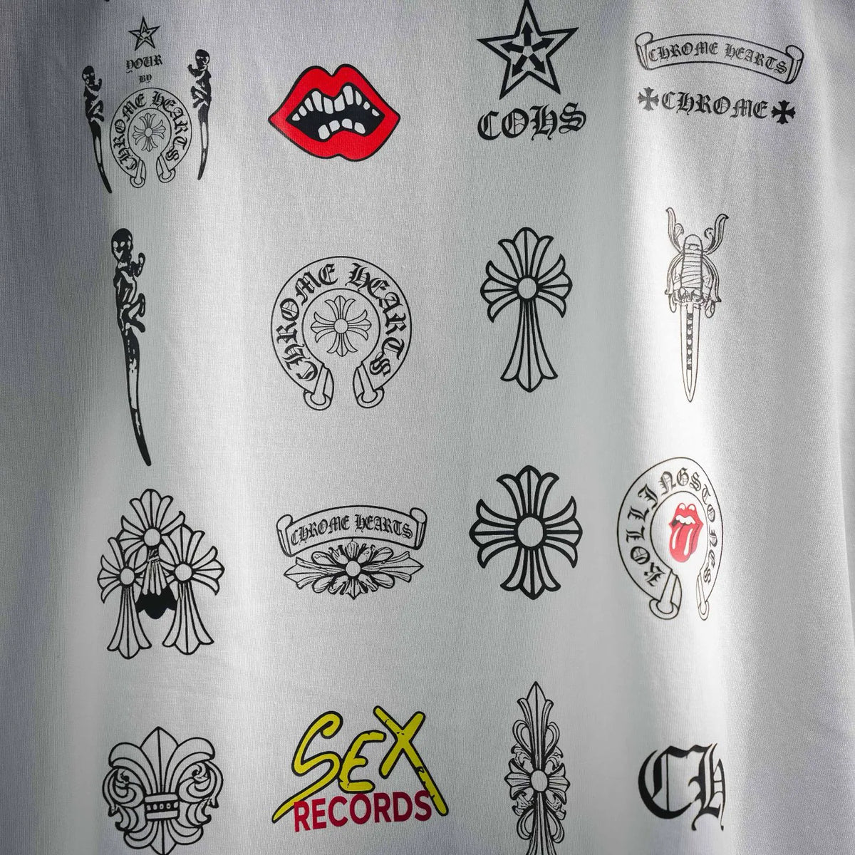White T-shirt with all-over black graphic logos and icons