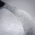 Light gray long-sleeve T-shirt shoulder seam detail