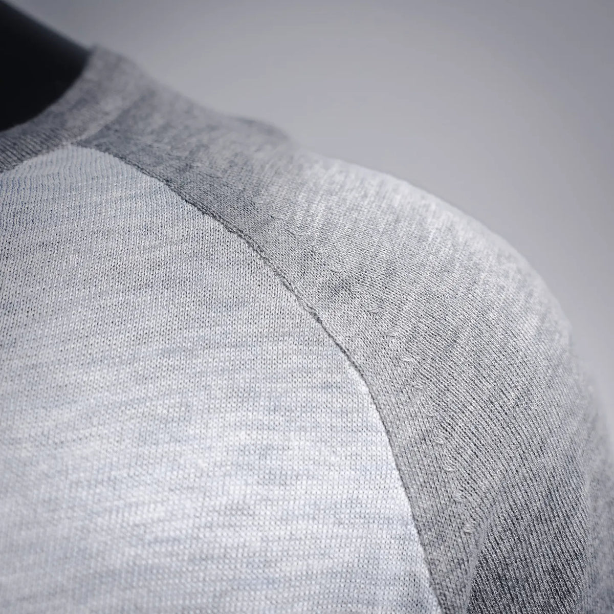 Light gray long-sleeve T-shirt shoulder seam detail
