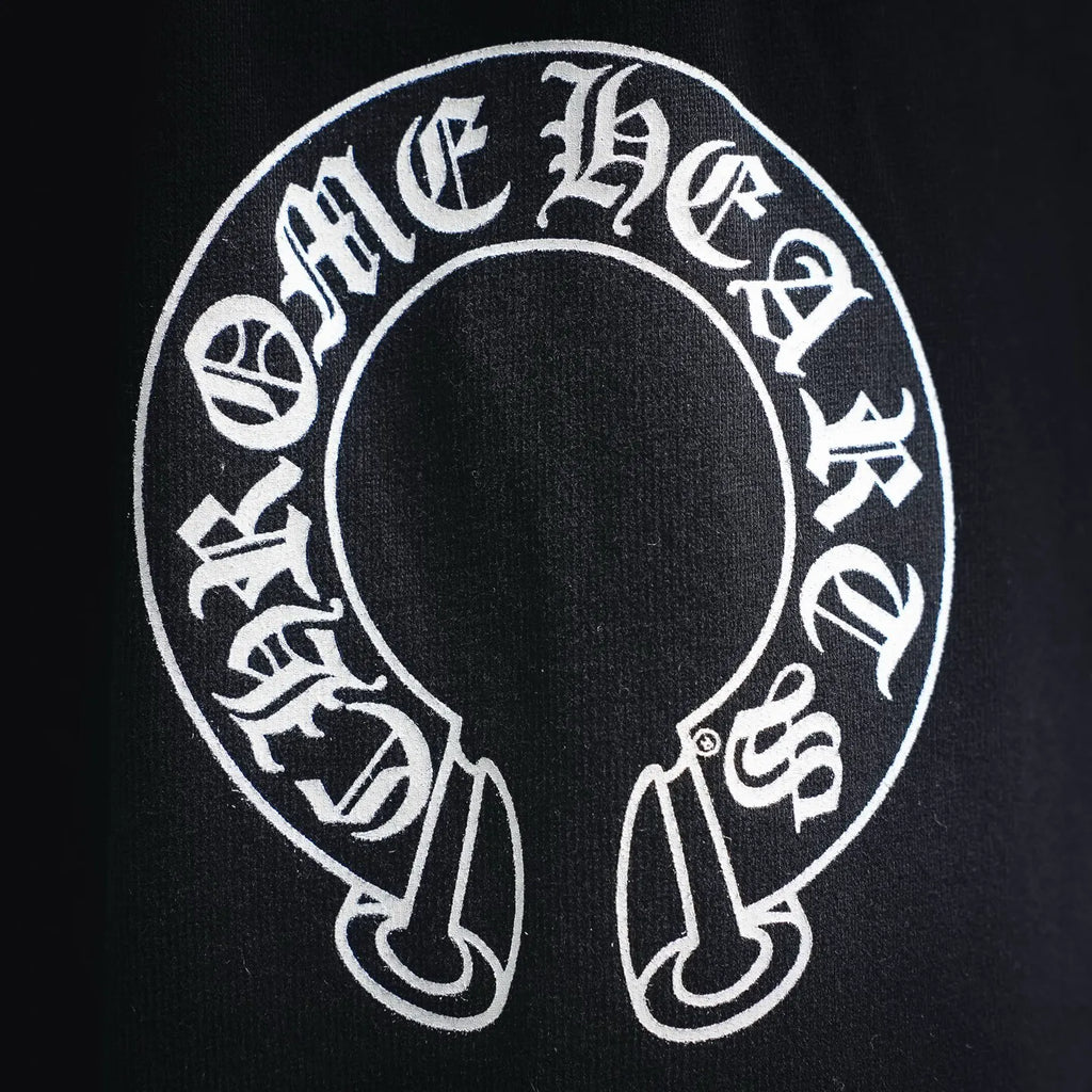 Black shorts with large circular white logo graphic on the front