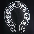 Black shorts with large circular white logo graphic on the front