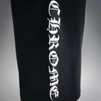 Black shorts with vertical white text graphic printed down one leg