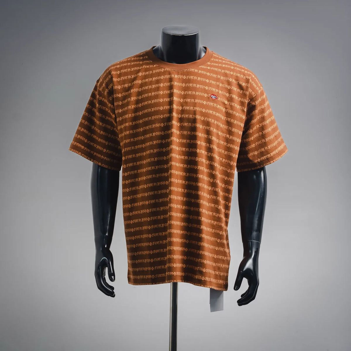 Orange short-sleeve T-shirt with allover white logo pattern, crew neck