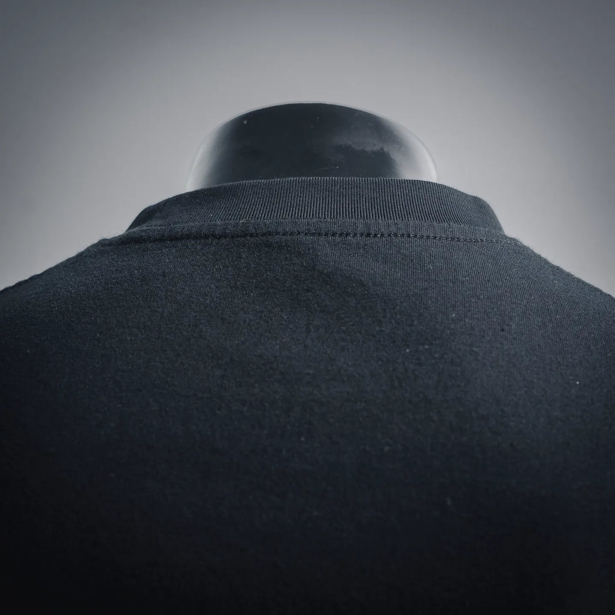 Close-up of T-shirt back yoke and collar seam