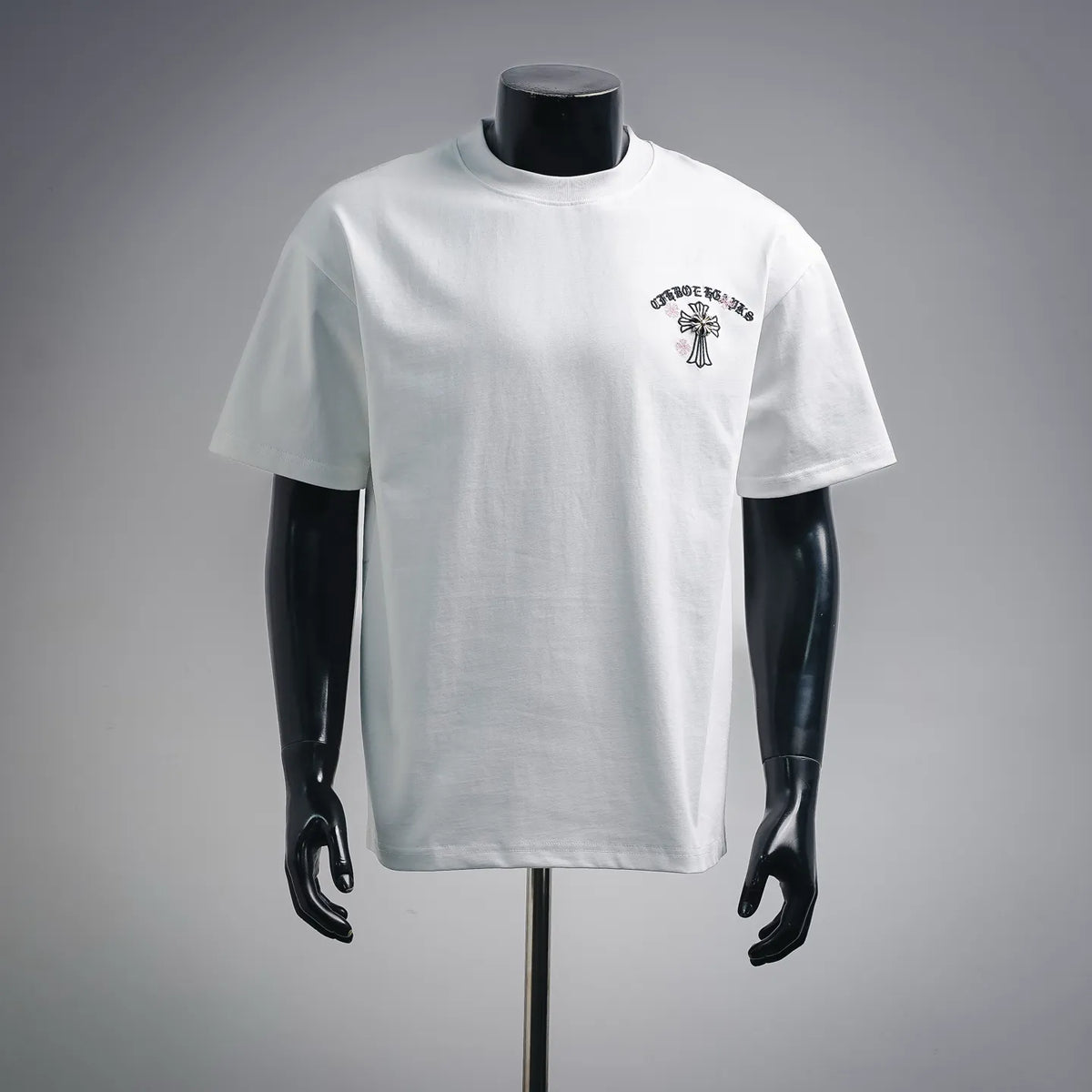 White short-sleeve T-shirt with small chest graphic design