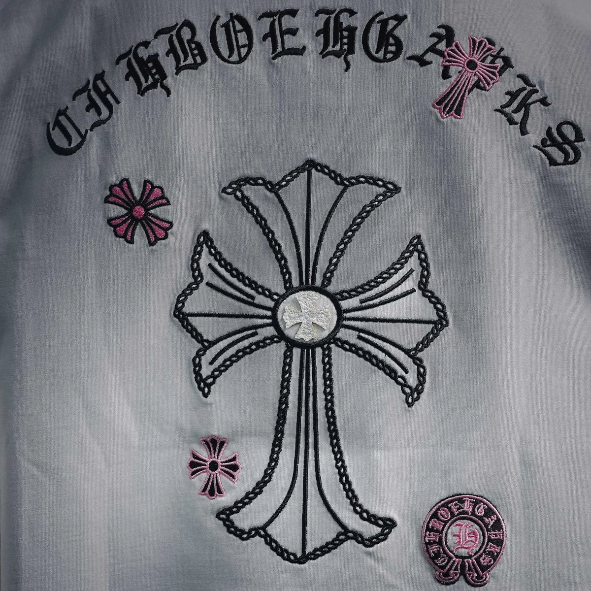 White short-sleeve T-shirt back graphic with cross and small emblem