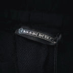 Dark shorts with embroidered brand label on interior waistband