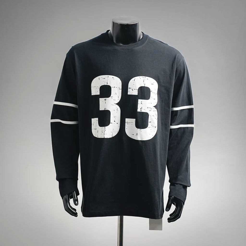 Black long-sleeve graphic T-shirt with large white "33" print and striped sleeve detail