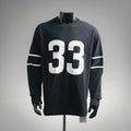 Black long-sleeve graphic T-shirt with large white "33" print and striped sleeve detail