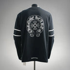 Black long-sleeve graphic T-shirt with back circular logo print and white sleeve stripes
