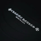 Black long-sleeve T-shirt close-up of neck label text reading "Made in U.S.A"