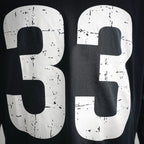 Black long-sleeve T-shirt with oversized distressed white "33" number print