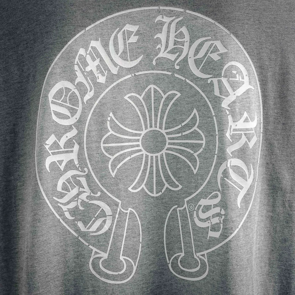 Close-up of circular back graphic logo on heather gray long-sleeve T-shirt