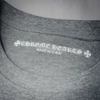 Neckline label text: brand name and "MADE IN U.S.A." on heather gray T-shirt