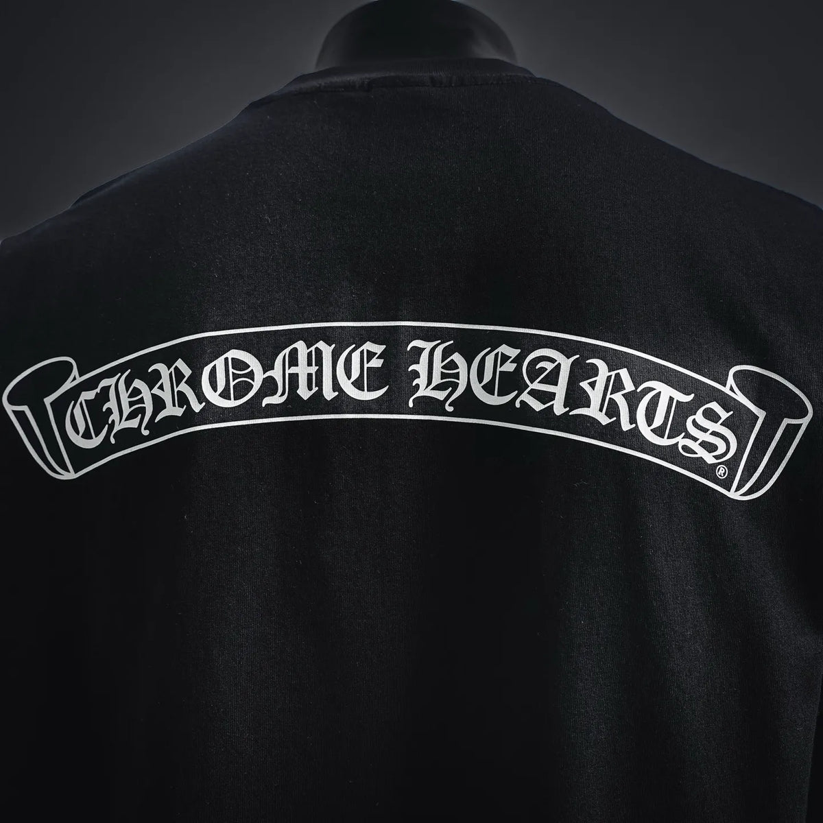 Black T-shirt back with large arched Chrome Hearts logo graphic
