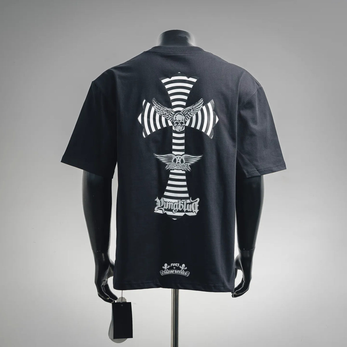 Men's dark navy T-shirt back shows large cross graphic with wings and text