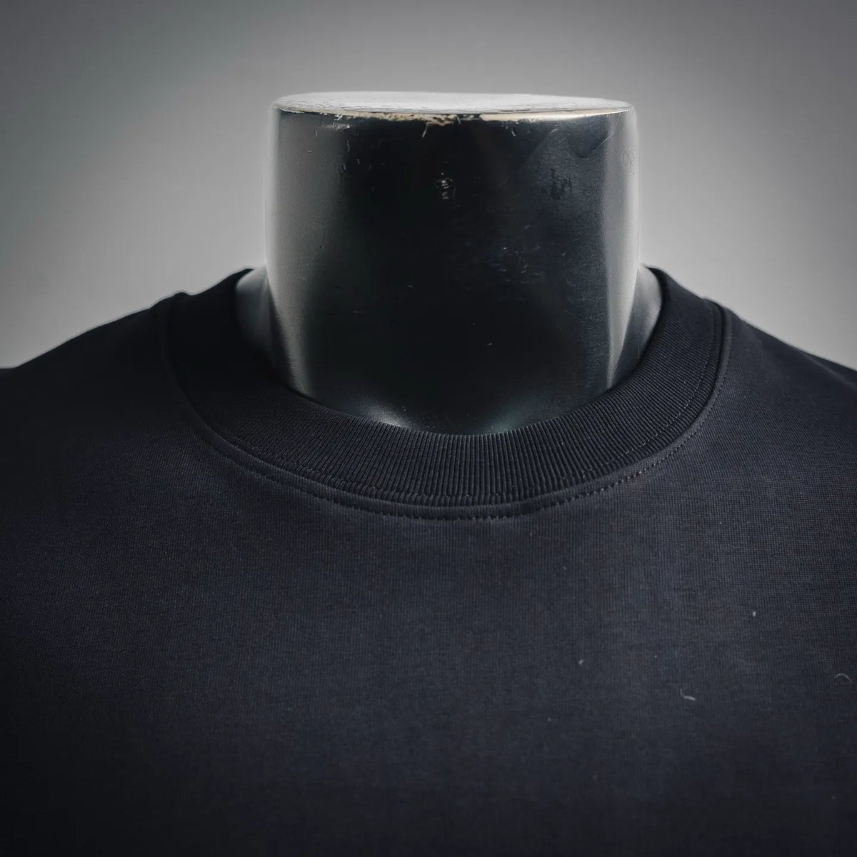 Dark navy crew-neck T-shirt collar with ribbed neckline and smooth fabric