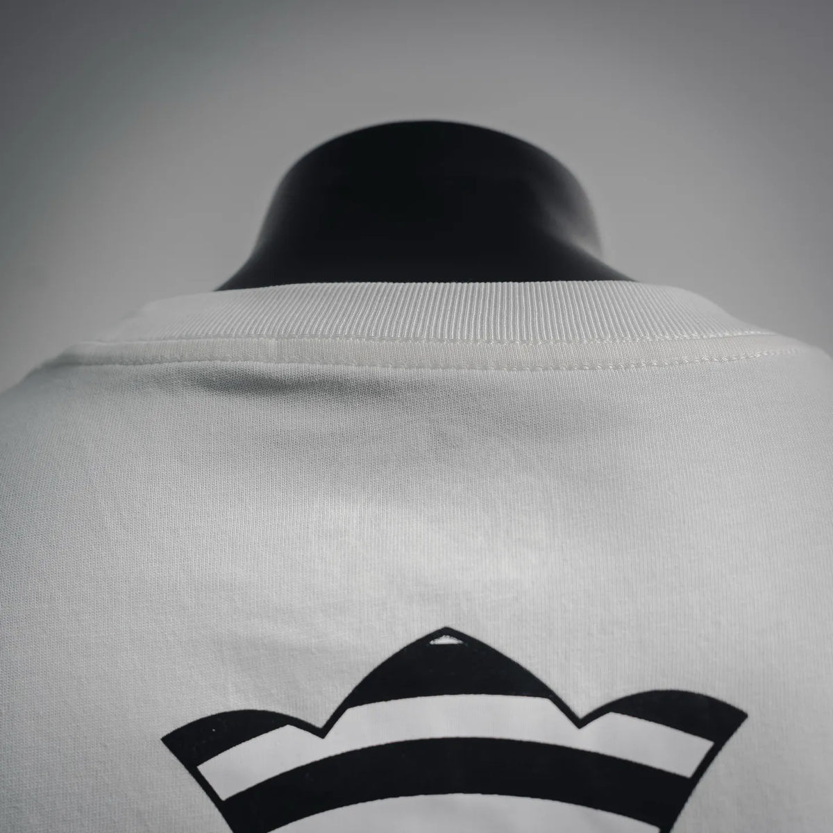 Back collar and upper design detail on white short-sleeve T-shirt