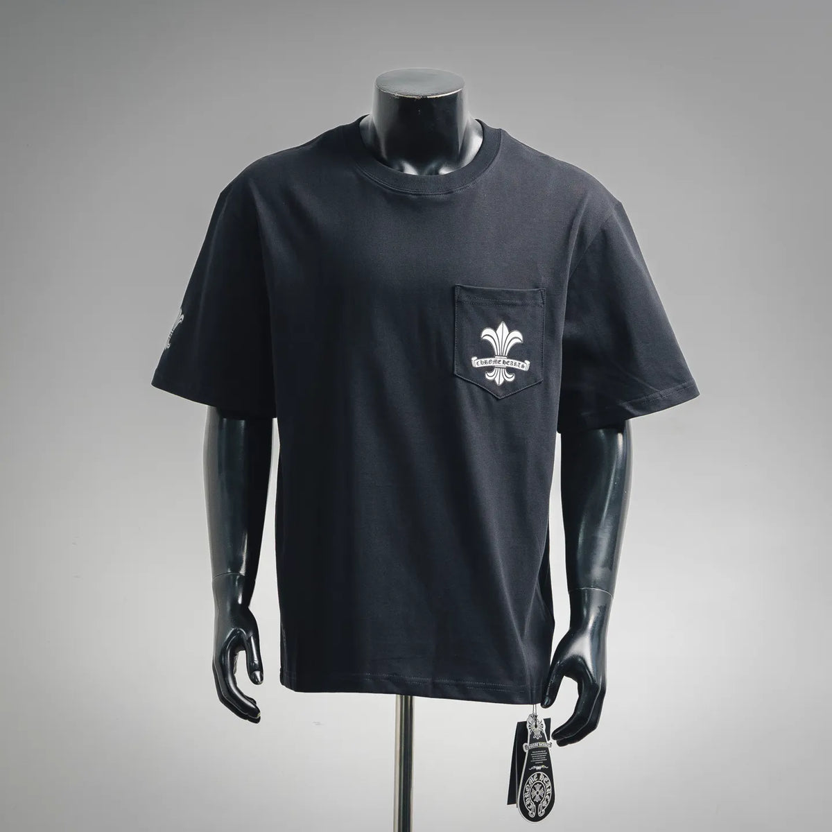 Black crew-neck short-sleeve T-shirt with front pocket and fleur-de-lis graphic
