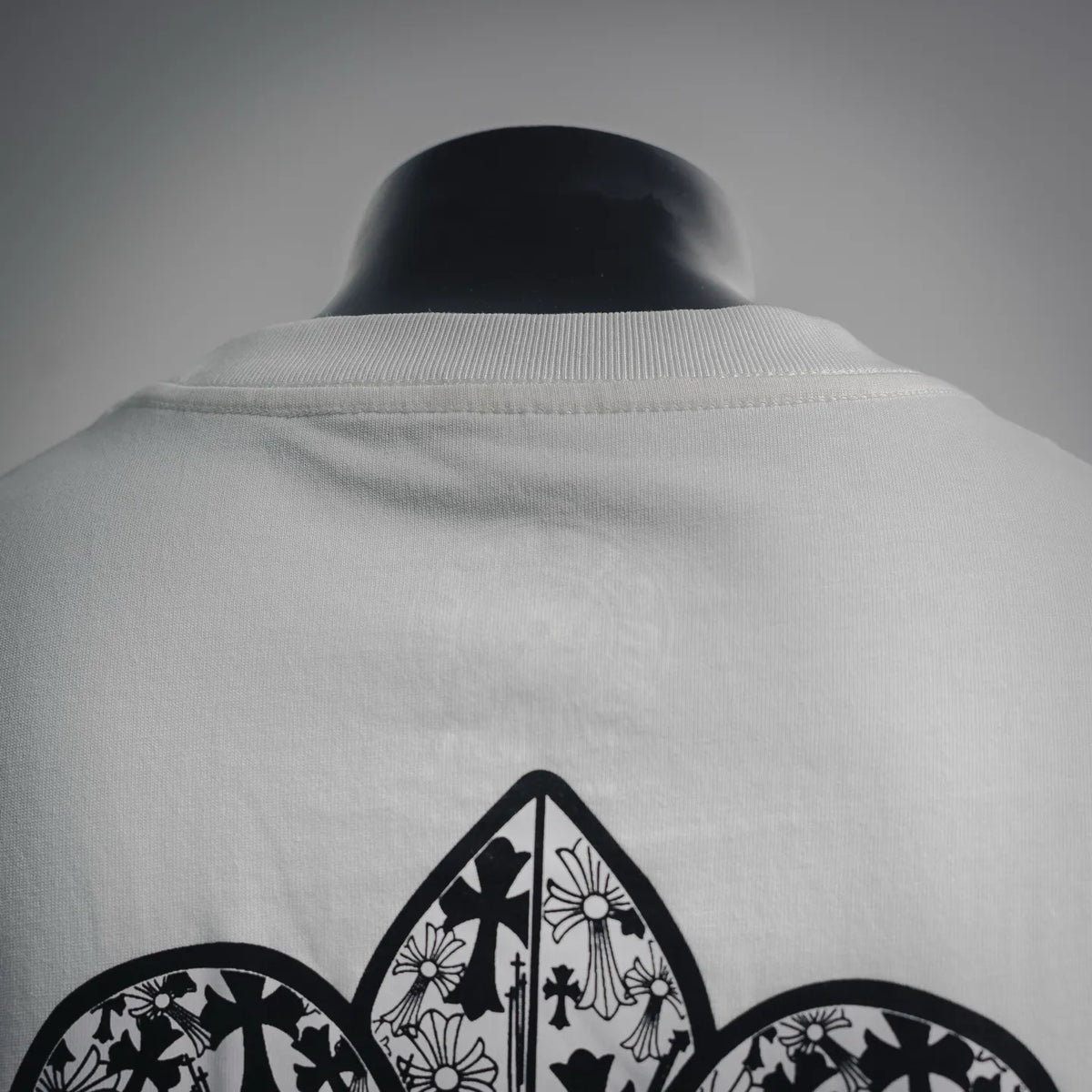 Chrome Hearts white T-shirt back upper section with partial fleur-de-lis print
