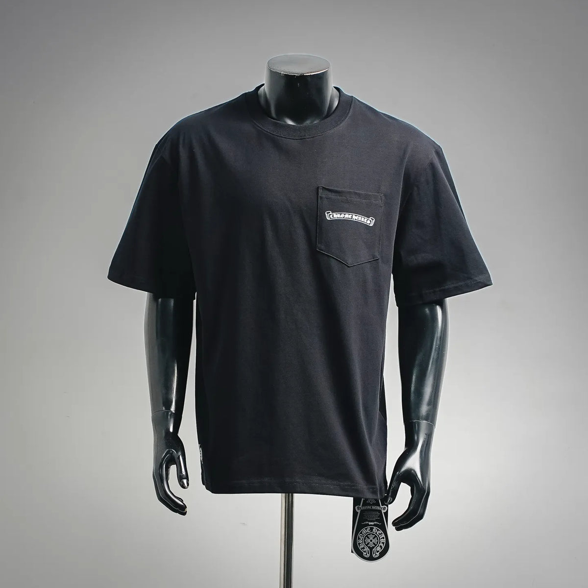 Dark crewneck T-shirt with chest pocket and Chrome Hearts-style logo graphic