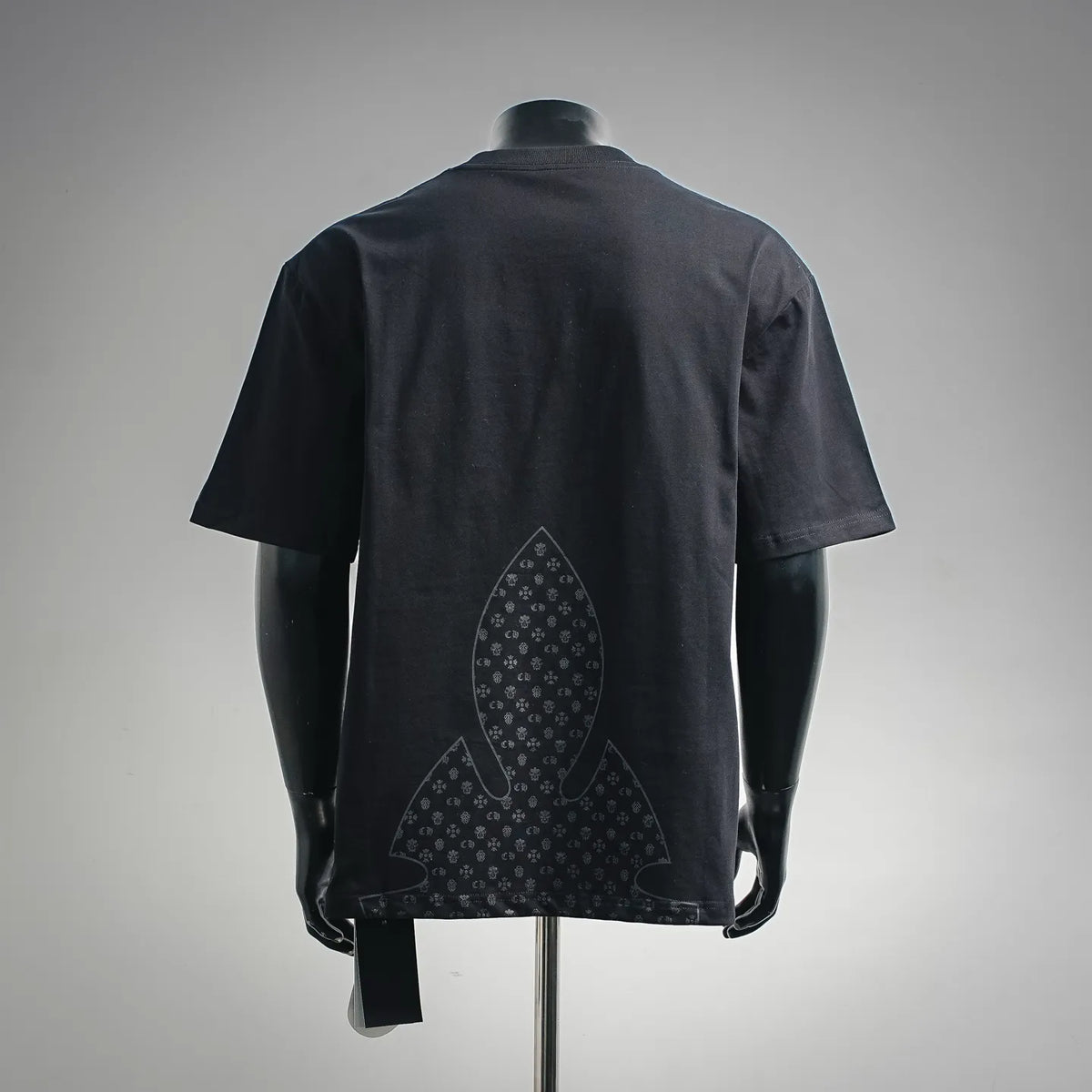 Dark crewneck T-shirt with large fleur-de-lis style graphic on back