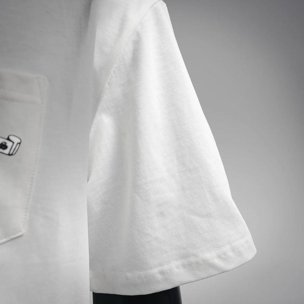 White T-shirt side seam and curved short sleeve hem