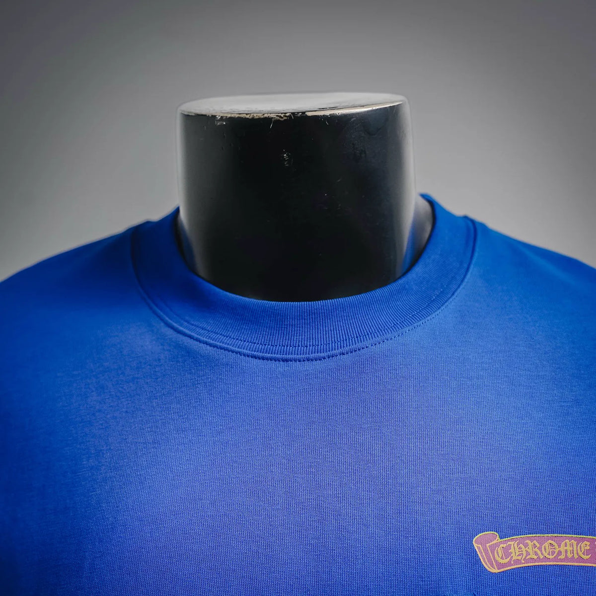 Blue short-sleeve T-shirt with ribbed crew neck and small right-chest logo