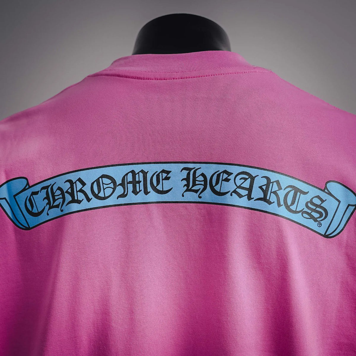 Pink T-shirt back with large centered graphic logo