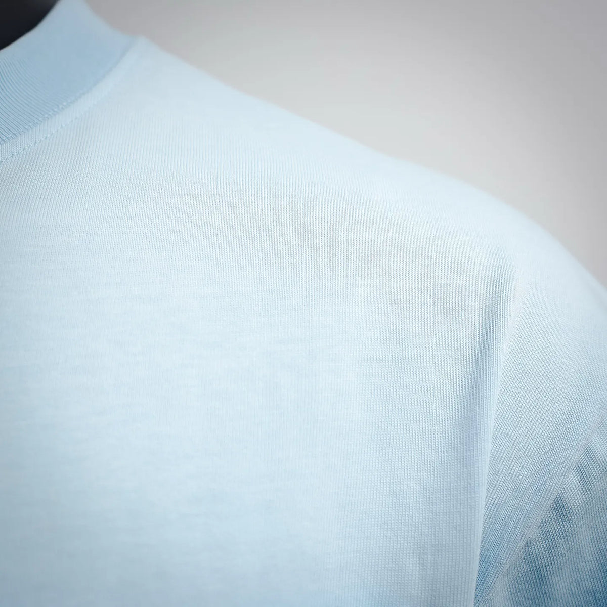Light blue T-shirt back fabric with smooth knit texture