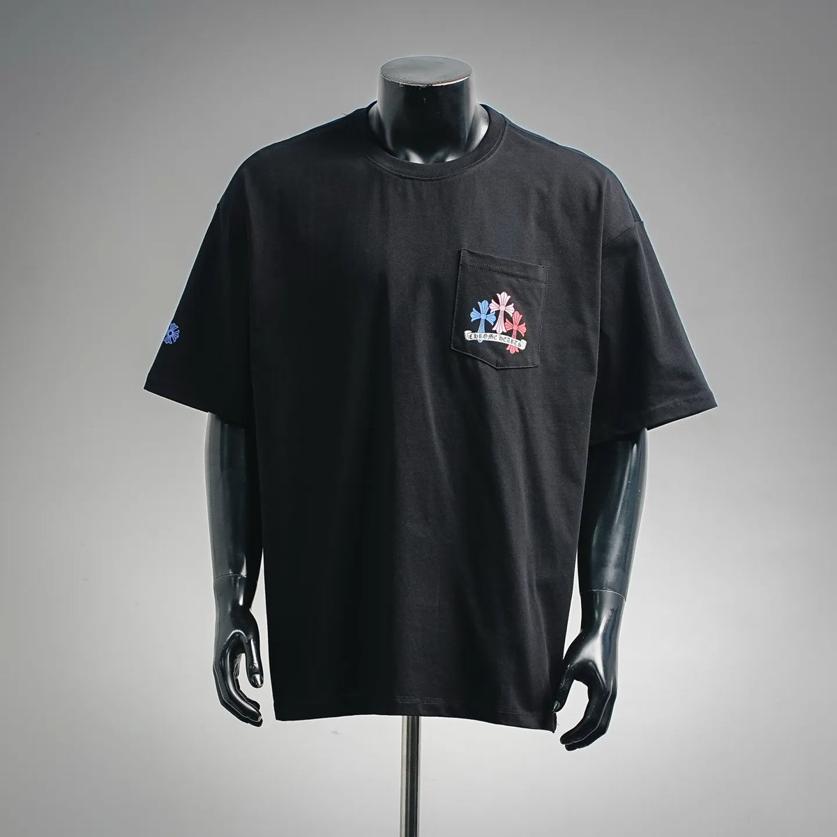 Black short-sleeve T-shirt with small chest pocket graphic