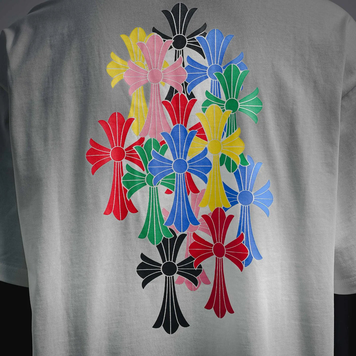 White graphic T-shirt close-up of colorful floral back/center artwork