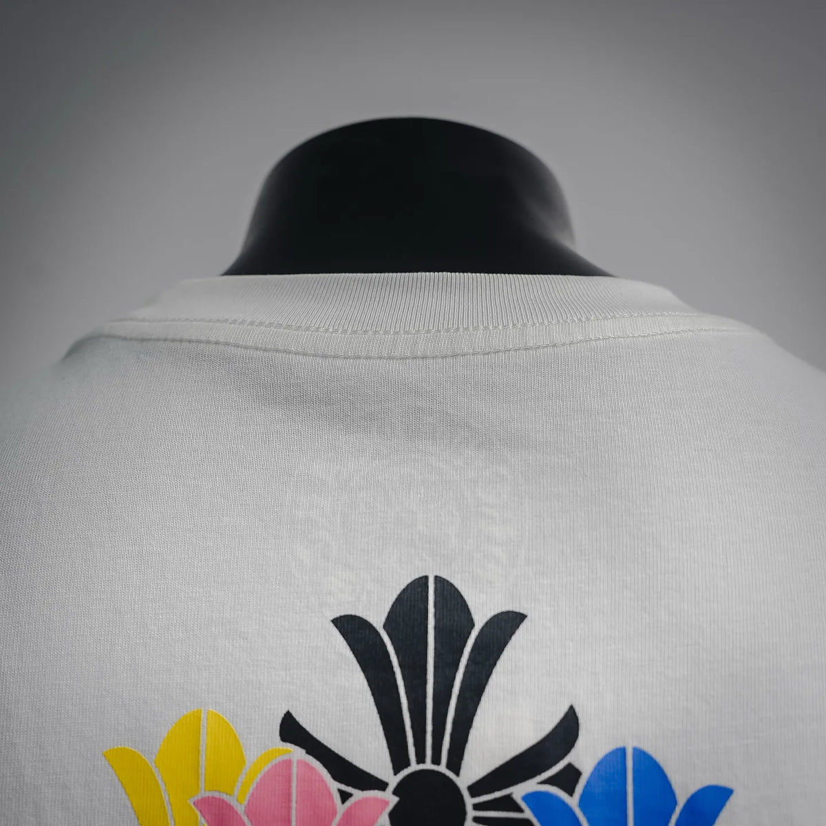 White graphic T-shirt back collar with partial floral artwork