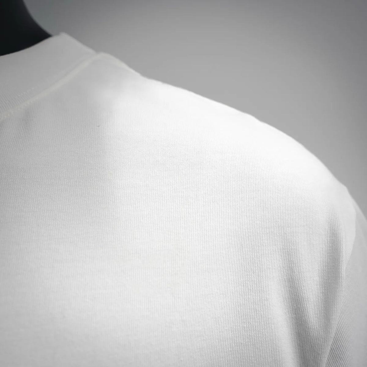 White T-shirt fabric texture from shoulder and upper arm