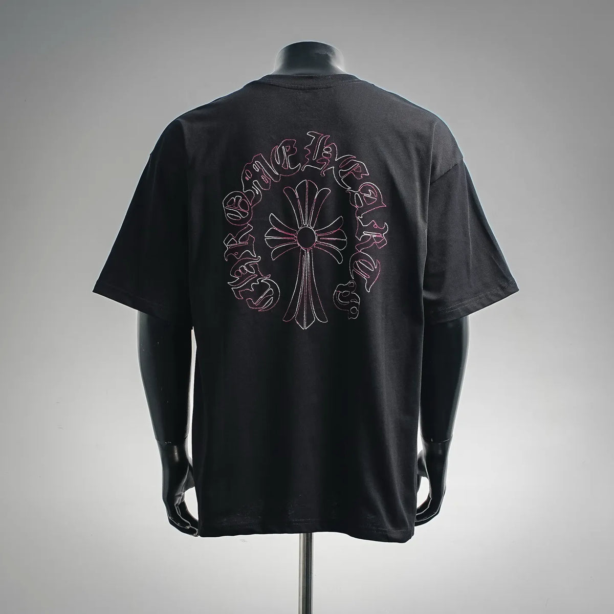 Black short-sleeve T-shirt with large back circular pink-and-white graphic
