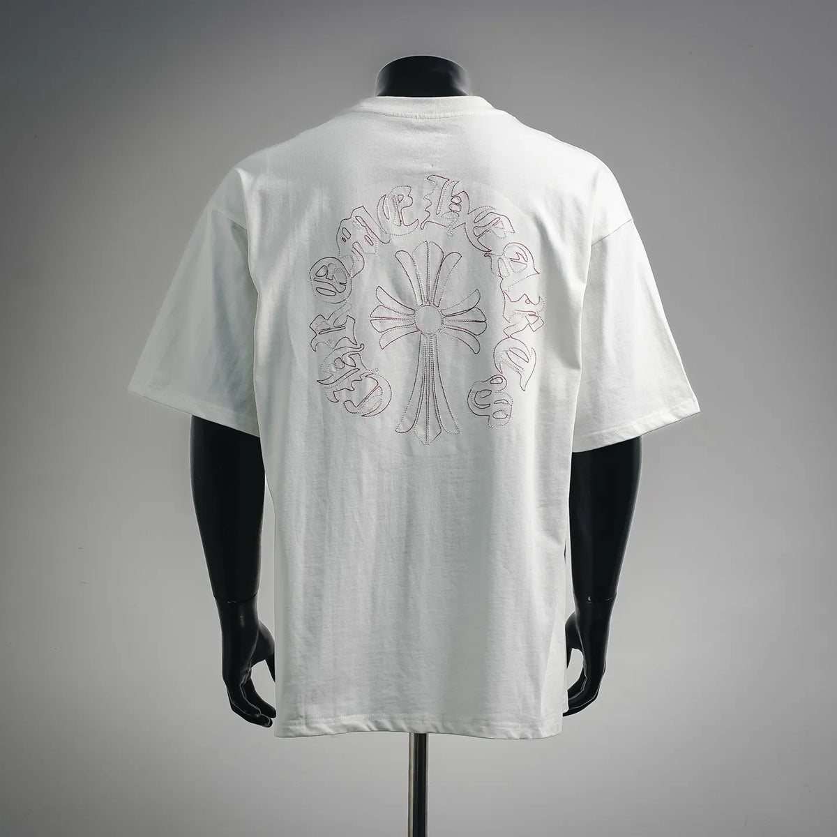 White short-sleeve T-shirt with large back pink embroidered cross-flower design