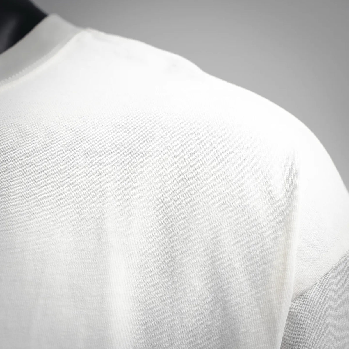 White T-shirt fabric close-up with subtle texture