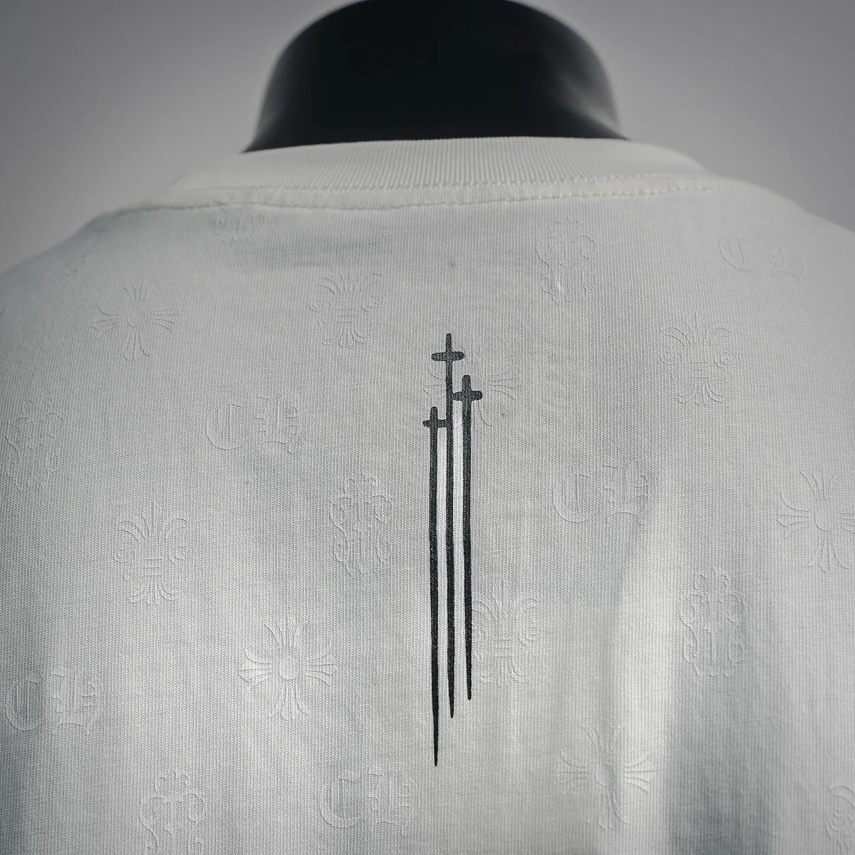 White T-shirt back print with vertical cross and small symbol pattern
