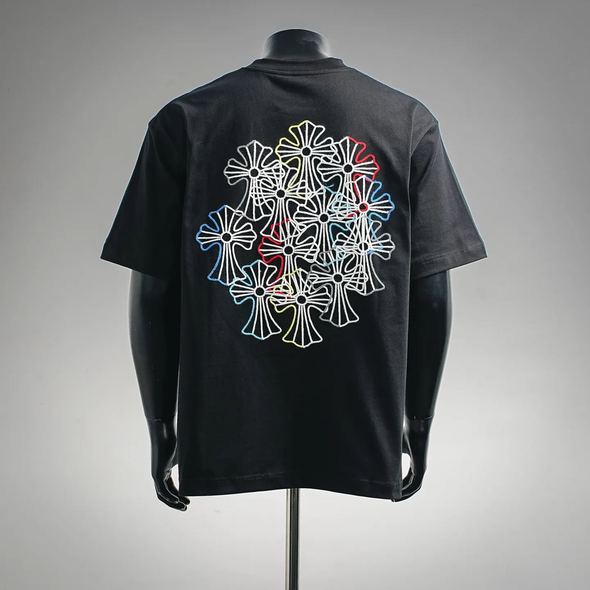 Black crewneck T-shirt with large multicolor embroidered flower graphic on back