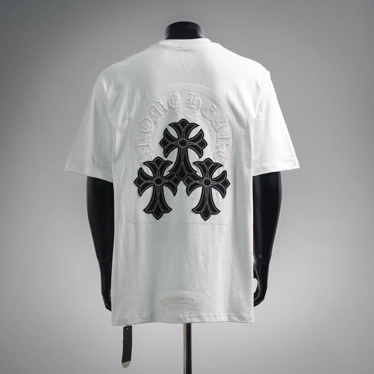 White short-sleeve T-shirt with large embroidered cross design on the back